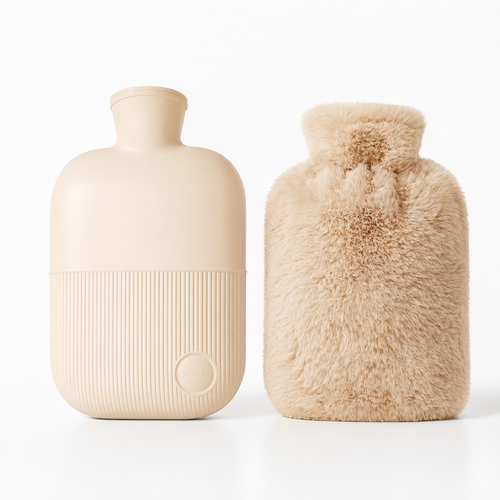 Two beige hot water bottles on a clean white background, one with a ribbed matte finish and a circular logo embossed near the bottom, and the other covered in soft fluffy faux fur.