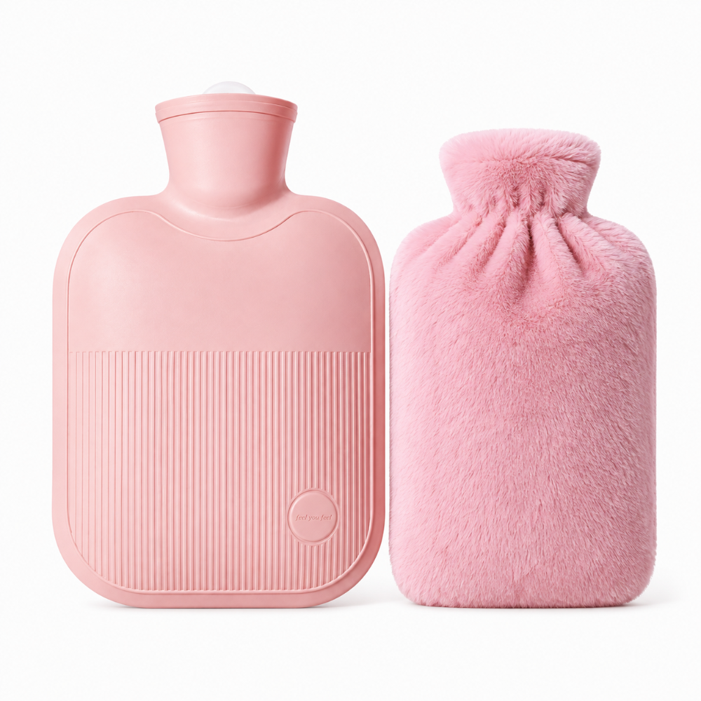 A light pink hot water bottle with a ribbed front and a matching fluffy pink cover beside it, photographed on a clean white background.