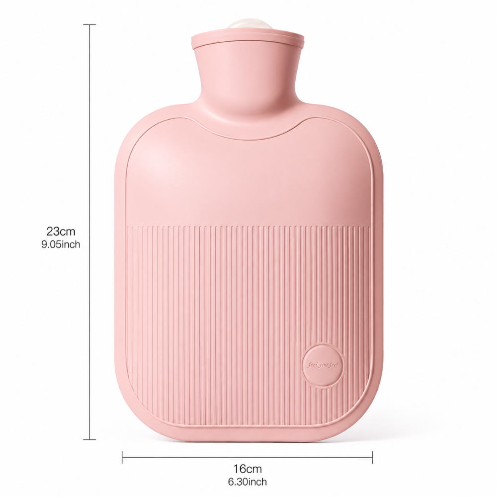 A pink hot water bottle with dimension markings showing a height of 23cm (9.05inch) and a width of 16cm (6.